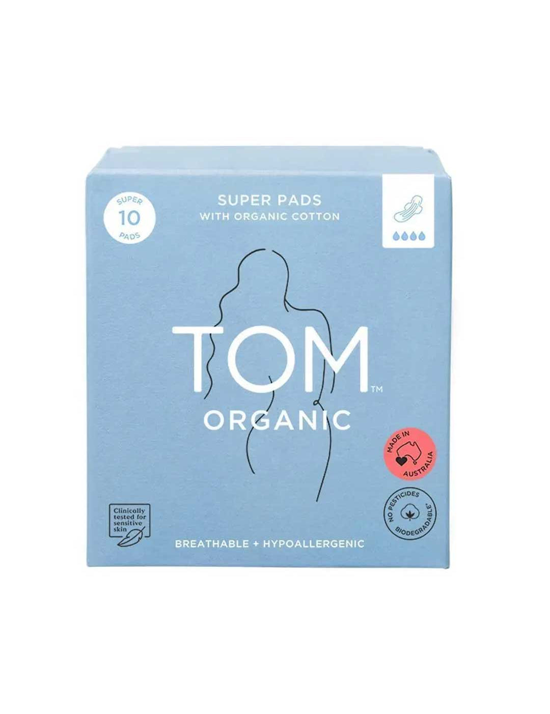 A blue box of TOM Organic Pads Extra Super 10pk features organic cotton pads, a woman’s body outline, and labels for breathability, hypoallergenic, and chemical-free benefits.