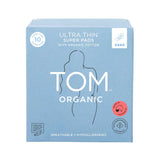 Light blue box of TOM Organic Pads Super 10pk made with organic cotton, featuring a simple female silhouette, key product info, and certification symbols—biodegradable pads designed for comfort and sustainability.