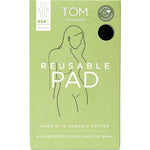 A green box of TOM Organic Reusable Pad with a minimalist woman’s line drawing. Chemical-free and made from organic cotton, these pads offer 4-layer protection and are easy to wash for safe, sustainable period care.