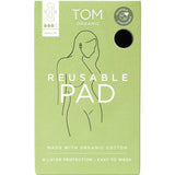 A green box of TOM Organic Reusable Pad with a minimalist woman’s line drawing. Chemical-free and made from organic cotton, these pads offer 4-layer protection and are easy to wash for safe, sustainable period care.