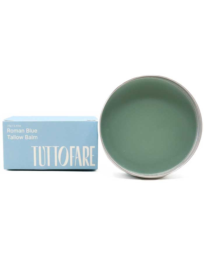 A 70g tin of Tuttofare Roman Blue Tallow Balm, made with grass-fed beef tallow and blue tansy, sits beside its matching blue TUTTOFARE box.