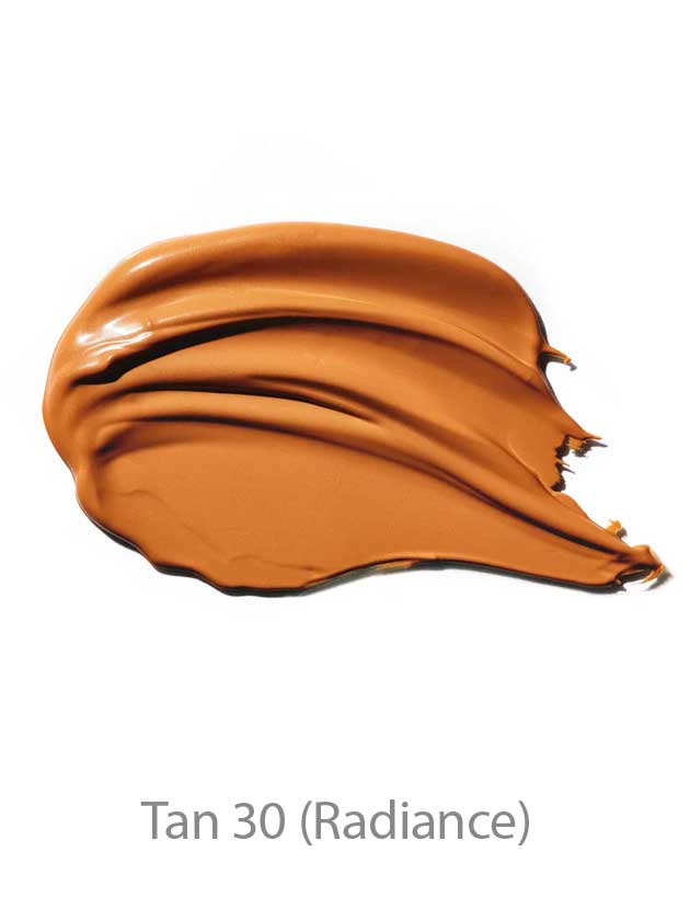 A smooth swatch of tan 100% Pure BB Cream 30ml with a creamy texture on a white background. This makeup-skincare hybrid provides radiant, glowing coverage. Text below reads Tan 30 (Radiance).