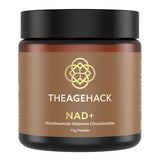 Small amber The Age Hack NAD+ powder jar with a broad black screw lid and a gold-brown label, with a gold geometric emblem above white brand lettering and the NAD+ name.
