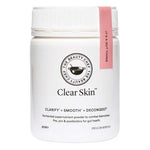A white container of The Beauty Chef Clear Skin™ Berry 150g with a pink-labeled lid. This fermented supernutrient powder supports gut and skin health, and is formulated to clarify and decongest blemish-prone skin.