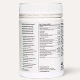 A white plastic jar labeled "The Beauty Chef GUT PRIMER+® 140g" with a white cap features text highlighting GutGard for abdominal bloating relief and a nutrition panel listing gut health powder ingredients. The background is light beige.