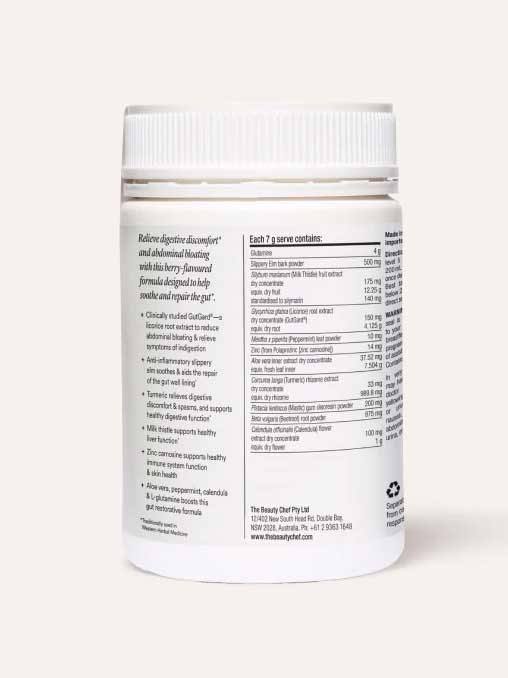 A white plastic jar labeled "The Beauty Chef GUT PRIMER+® 140g" with a white cap features text highlighting GutGard for abdominal bloating relief and a nutrition panel listing gut health powder ingredients. The background is light beige.