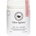 A white jar of The Beauty Chef Glow Ageless™ 150g fermented supernutrient powder for gut health, skin, and wellness, with a pink tag labeled “IT’S A GUT THING” attached to the lid.
