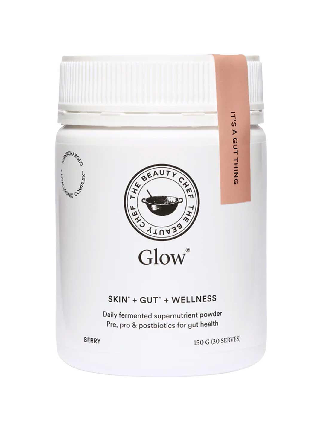 A white jar of The Beauty Chef Glow® 150g berry-flavored supernutrient powder for gut health, skin, and wellness. It features black text and a pink lid tag reading "IT'S A GUT THING," promoting glowing skin.