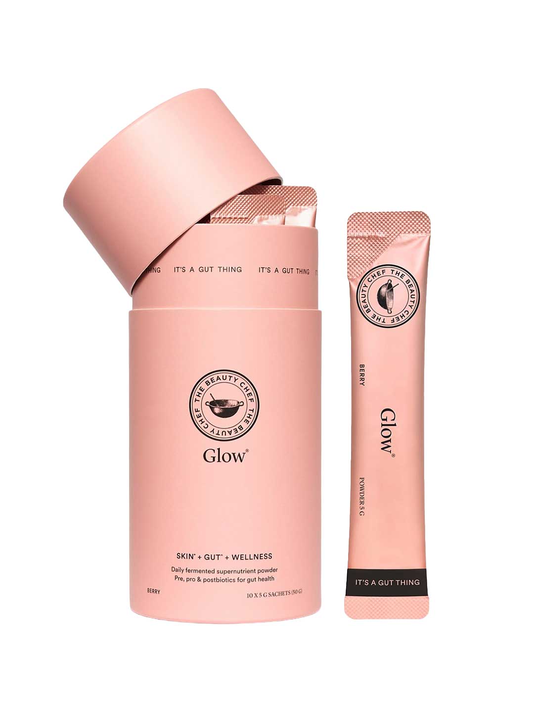 An open pink cylindrical container labeled The Beauty Chef Glow® Sachets 10x 5g reveals individual pink sachets, with one upright beside it. The packaging highlights gut health and Skin + Gut + Wellness for radiant skin.