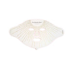 The Vanessa Megan The Butterfly Effect Medical-Grade Silicone LED Face Mask is a white mask with eye, nose, and mouth cutouts, adorned with gold lines and dots—an elegant at-home skincare device.