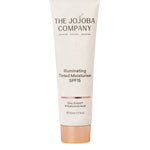 The Jojoba Company Illuminating Tinted Moisturiser SPF15 50ml, containing zinc, ectoin, and hyaluronic acid for hydration and redness reduction, is shown upright against a white background.