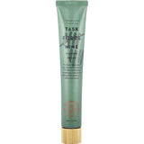 A green tube labeled The Organic Skin Co Task Force Nine Calming Cream 60ml with a gold cap, ideal for sensitive skin. Made with turmeric and calendula, its minimal design features text and a small logo at the bottom.