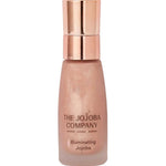 The Jojoba Company Illuminating Jojoba 50ml, a radiance-boosting facial oil in a clear glass bottle with a gold pump, blended with light-reflecting mica, jasmine and mandarin for a luminous glow.