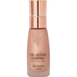 The Jojoba Company Illuminating Jojoba 50ml, a radiance-boosting facial oil in a clear glass bottle with a gold pump, blended with light-reflecting mica, jasmine and mandarin for a luminous glow.