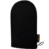 The Three Warriors Eco Friendly Tanning Mitt is a black mitt with a rounded top, hanging loop, and black-and-gold side tag, designed for streak-free self-tanning mousse application. Shown on a plain white background.