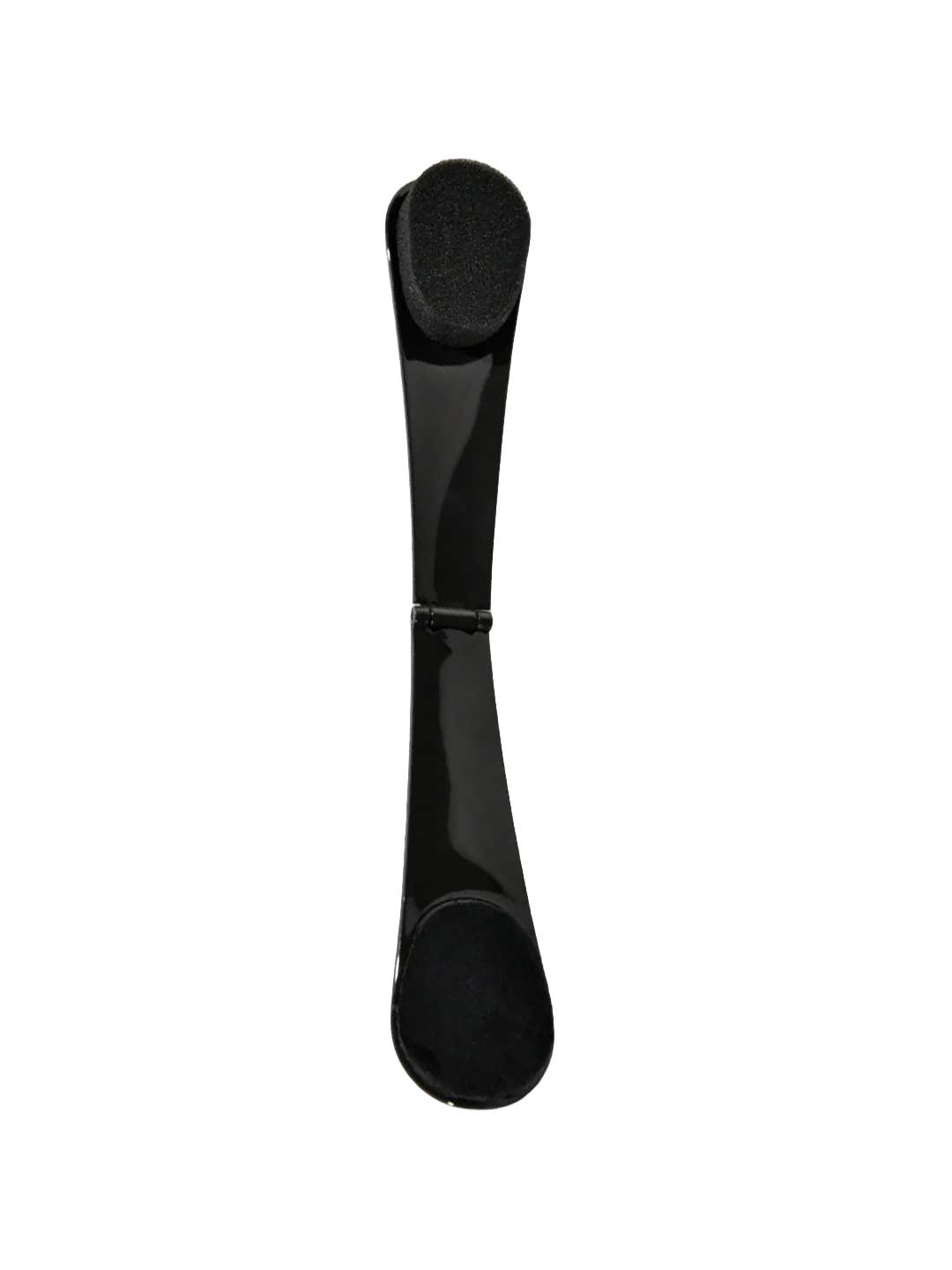 A black, curved hair clip with rounded ends and a central hinge is shown on a white background, ideal for holding hair in place while using the Three Warriors Self-Tan Back Applicator.