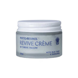 A 50ml glass jar of Thrive Tallow Phyto-Retinol Revive Creme with a white screw-on lid. The white label features blue text listing blue tansy and bakuchiol as ingredients. This anti-aging night cream is designed for nightly use.