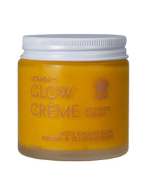 Thrive Tallow Vitamin C Glow Creme in a bright yellow-orange jar with a ribbed white lid and gold lettering.