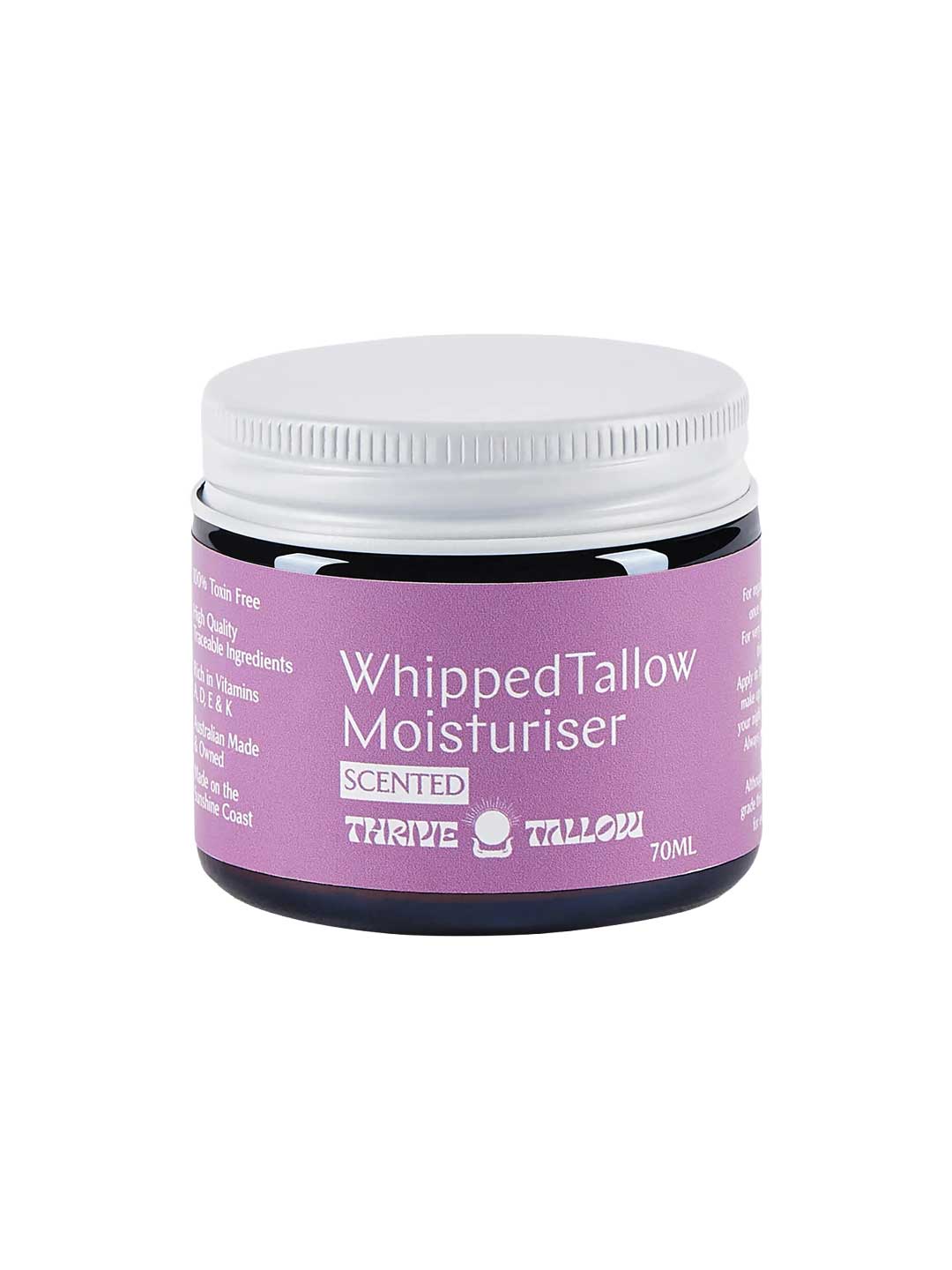A 70ml jar of Thrive Tallow Whipped Tallow Moisturiser Ylang Ylang & Vanilla, with a purple label highlighting whipped balm benefits in white text and a white screw lid.