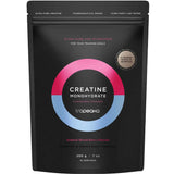 Tropeaka Creatine Monohydrate Mixed Berry 200g comes in a black pouch with pink, blue, and white circular graphics. It features a Natural Mixed Berry Flavour to support muscle strength and includes 52 servings per pack.