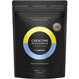 A black pouch of Tropeaka Creatine Monohydrate Pineapple 200g offers 52 servings of ultra-pure, micronized creatine with natural pineapple flavour to support muscle strength. The packaging features yellow and blue accents.