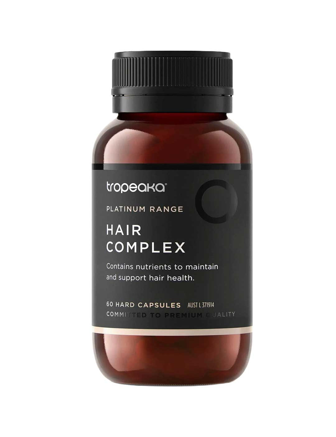 A brown bottle labeled Tropeaka Hair Complex 60 Caps with a black lid. The label notes it provides nutrients to support and maintain hair health, and contains 60 hard capsules by Tropeaka.