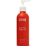 A red bottle of Tuttofare Not Your Regular Body Oil 200ml with a white pump dispenser; the label reads "Italian Sunset" and describes it as a nourishing natural moisturizer, containing 6.7 fl oz.