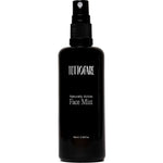 A black spray bottle of Tuttofare Naturally Active Face Mist 100ml is displayed against a plain white background.
