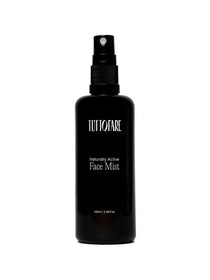 A black spray bottle of Tuttofare Naturally Active Face Mist 100ml is displayed against a plain white background.