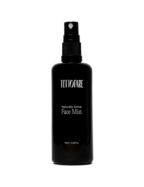 A black spray bottle of Tuttofare Naturally Active Face Mist 100ml is displayed against a plain white background.