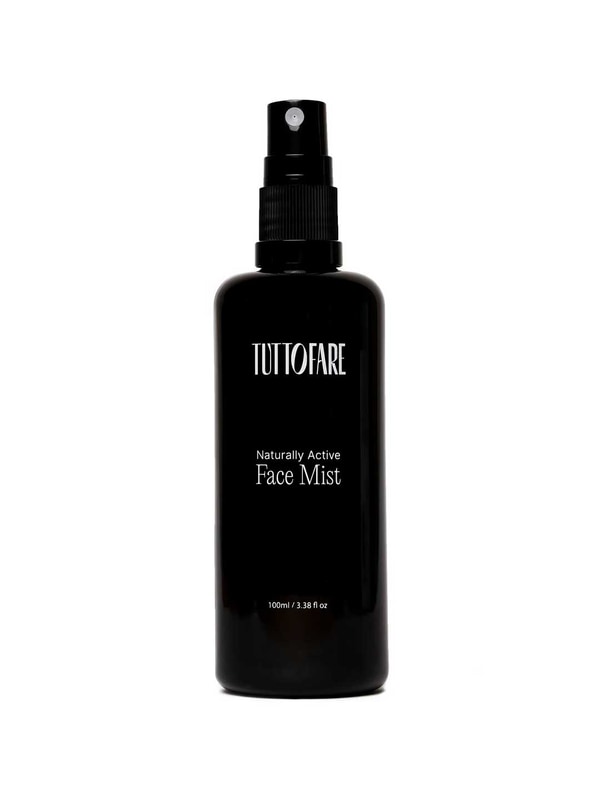 A black spray bottle of Tuttofare Naturally Active Face Mist 100ml is displayed against a plain white background.