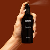 Hand spraying Tuttofare Naturally Active Face Mist