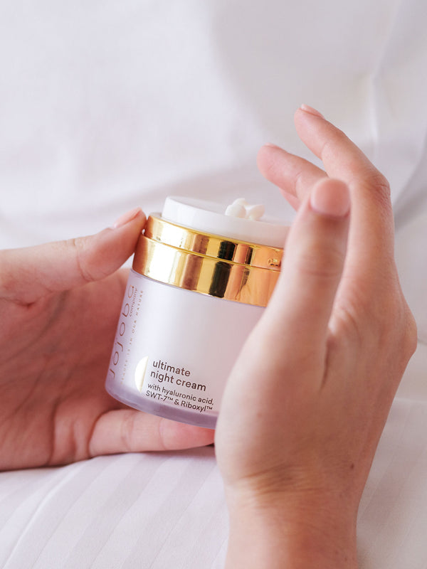 The Jojoba Company Ultimate Night Cream open jar showing the cream