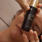 Model holding Vanessa Megan Bio-Omega Contouring Body Oil