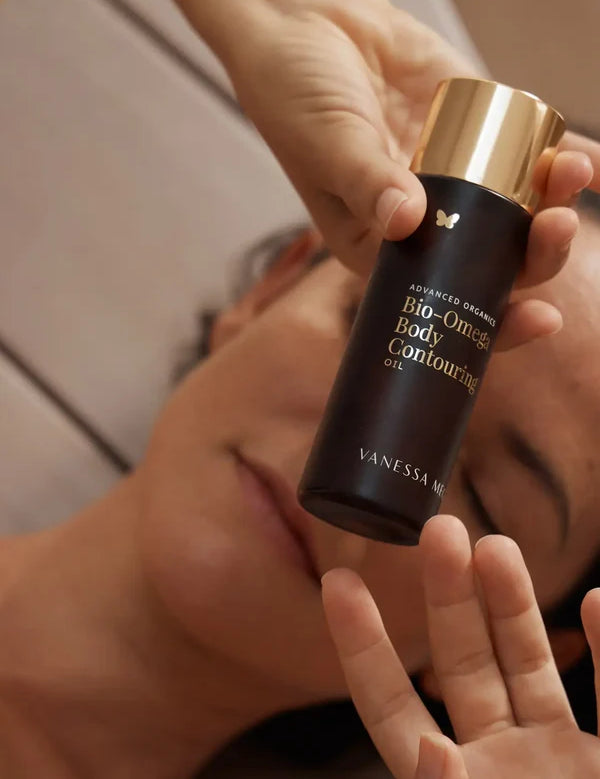 Model holding Vanessa Megan Bio-Omega Contouring Body Oil