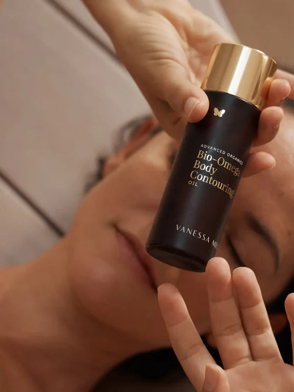 Model holding Vanessa Megan Bio-Omega Contouring Body Oil