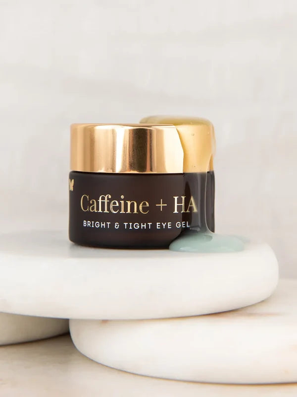 Vanessa Megan Caffeine and HA Bright and Tight Eye Gel jar on stones