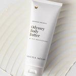 Vanessa Megan Odyssey Body Butter tube on textured backdrop