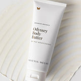 Vanessa Megan Odyssey Body Butter tube on textured backdrop