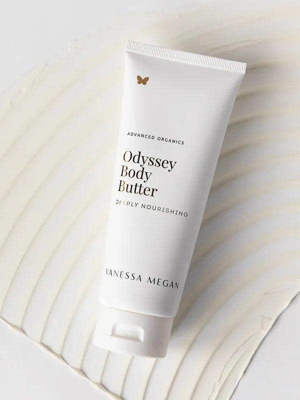 Vanessa Megan Odyssey Body Butter tube on textured backdrop