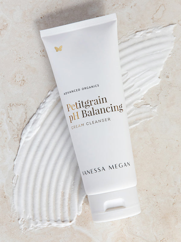 Vanessa Megan Petitgrain Cream Cleanser tube on a swipe of product