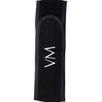 The Vanessa Megan 100% Cotton Waffle Beauty Headband in black features a centered white zigzag embroidery and is perfect for your daily skincare routine. Photographed on a plain white background.