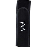 The Vanessa Megan 100% Cotton Waffle Beauty Headband in black features a centered white zigzag embroidery and is perfect for your daily skincare routine. Photographed on a plain white background.