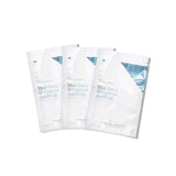 Three packets of Vanessa Megan Blue Tansy & Cypress Soothing Sheet Mask - 3 Pack, ideal for sensitive skin, are arranged overlapping on a white background. The mostly white packets feature light blue accents and text.