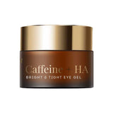 A dark brown cosmetic jar with a metallic gold lid, labeled 'Caffeine + HA BRIGHT & TIGHT EYE GEL' on a plain white background.