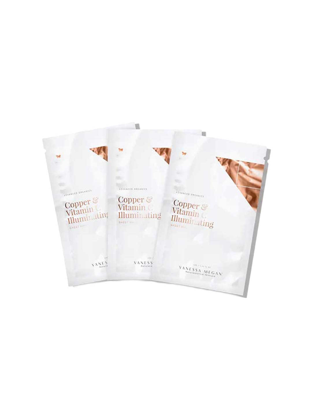 Three Vanessa Megan Copper & Vitamin C Illuminating Sheet Mask packets are arranged overlapping on a white background. The packaging features copper accents, emphasizing vitamin C benefits and collagen support.