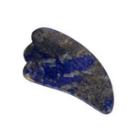 The Vanessa Megan Lapis Lazuli Gua Sha Massage Tool, featuring a blue and gold marbled design with a curved, ridged edge for lymphatic drainage, is displayed against a white background.