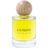 A clear glass bottle of Vanessa Megan Liliquoi 100% Natural Eau de Parfum 50ml, filled with yellow liquid and topped with a round wooden cap, displays the organic botanical fragrance against a white background.