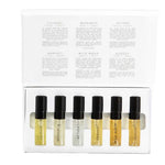 The Vanessa Megan 100% Natural Mini Eau de Parfum Collection (6 x 3ml) features six labeled vials with black caps in a white box. The inside lid lists scent descriptions, including a natural white-floral fragrance. All vials are neatly arranged in a row.