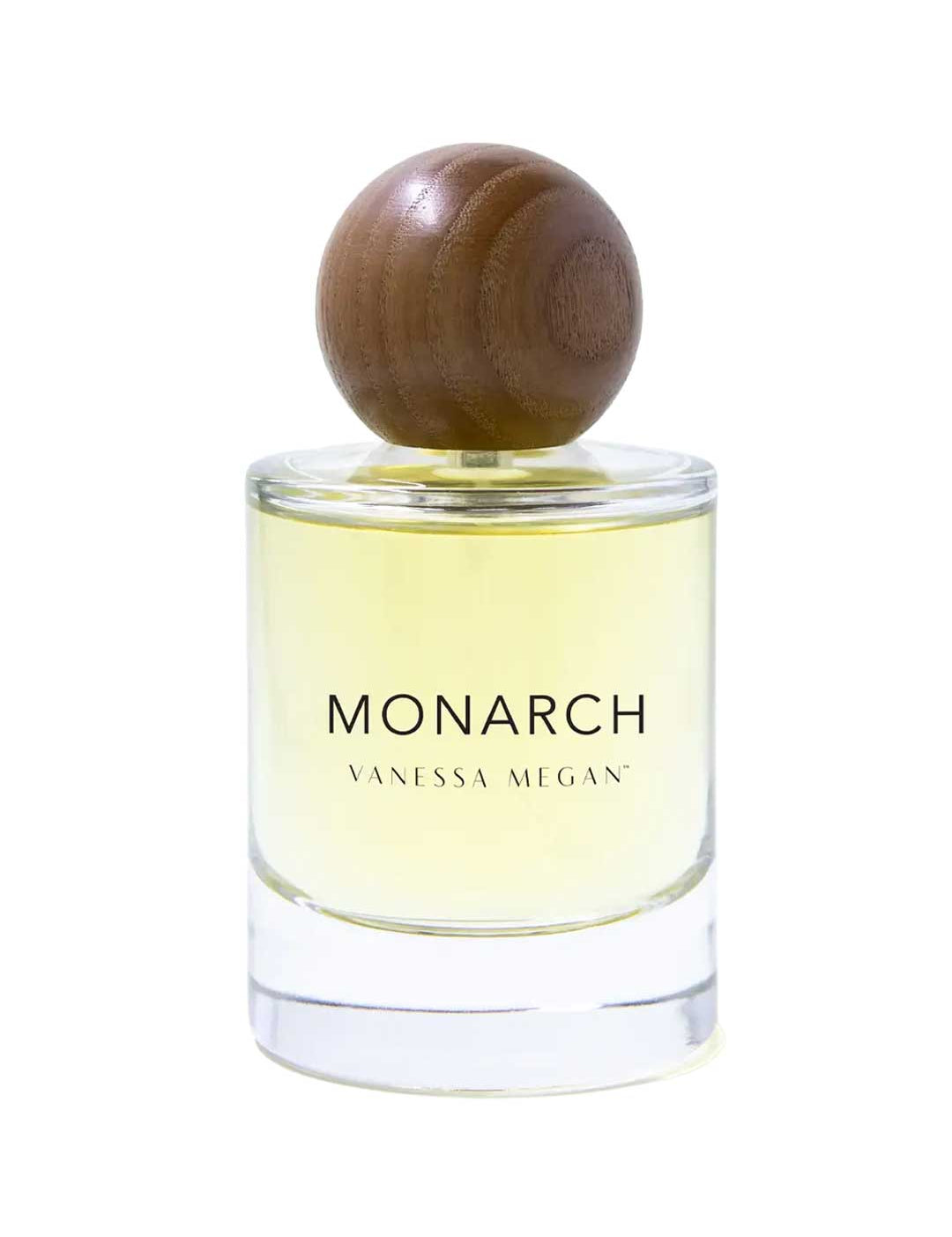 The Vanessa Megan Monarch 100% Natural Eau de Parfum 50ml features a clear glass bottle with yellow liquid and a round wooden cap, showcasing an elegant, floral-musk scent crafted with clean perfumery principles.